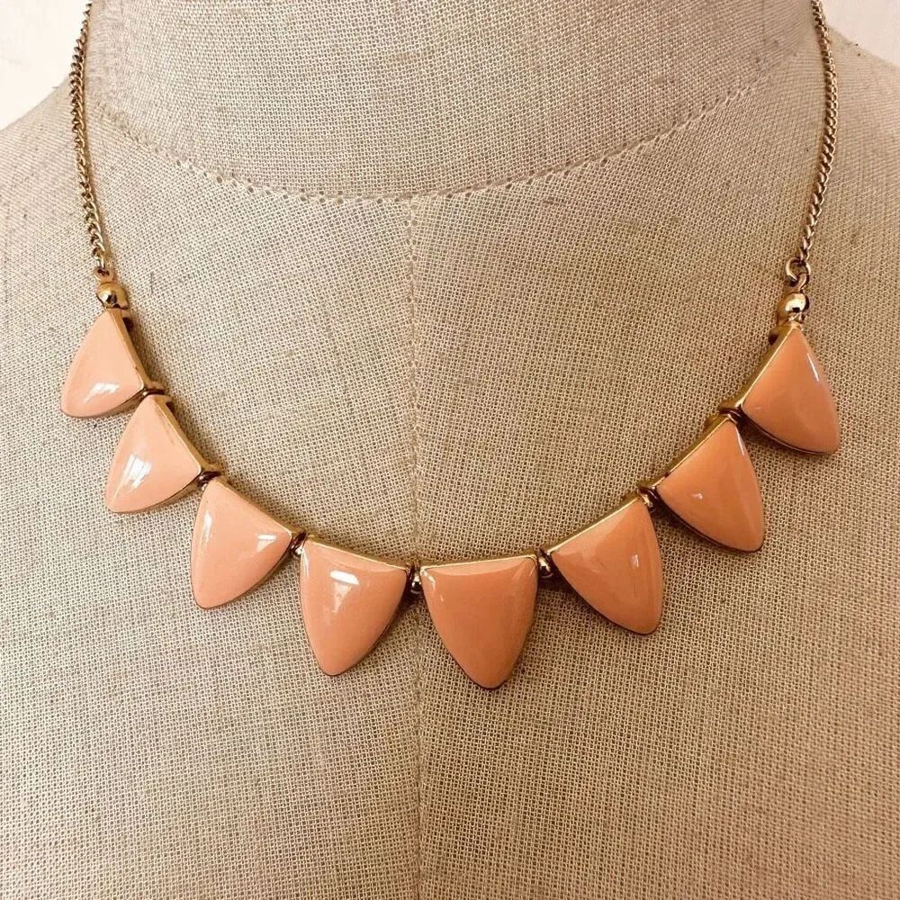 Peach enamel and  gold tone triangle necklace